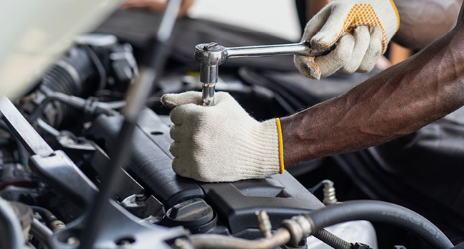 Technician working on engine